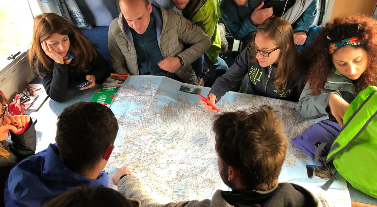 People around a map